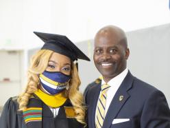 Dr. Jenkins photo with graduating student at commencement