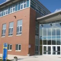Glass and brick exterior of Physical Education Complex on the campus of Coppin State University