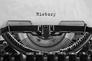 History typed on an vintage typewriter, old paper. close-up