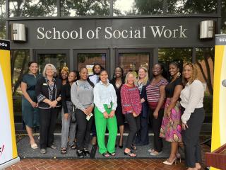 Social work students standing in front of University of Maryland School of Social Work