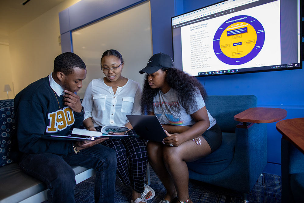 Students working together using a laptop