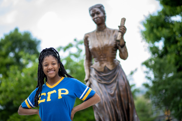 A student at the Fanny Jackson Coppin Statue