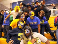 CSU students with faces painted blue and gold.