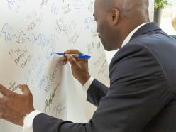 President Jenkins signs 'IN.'