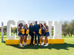 Cheerleaders with Dr. Jenkins at Golf Classic 