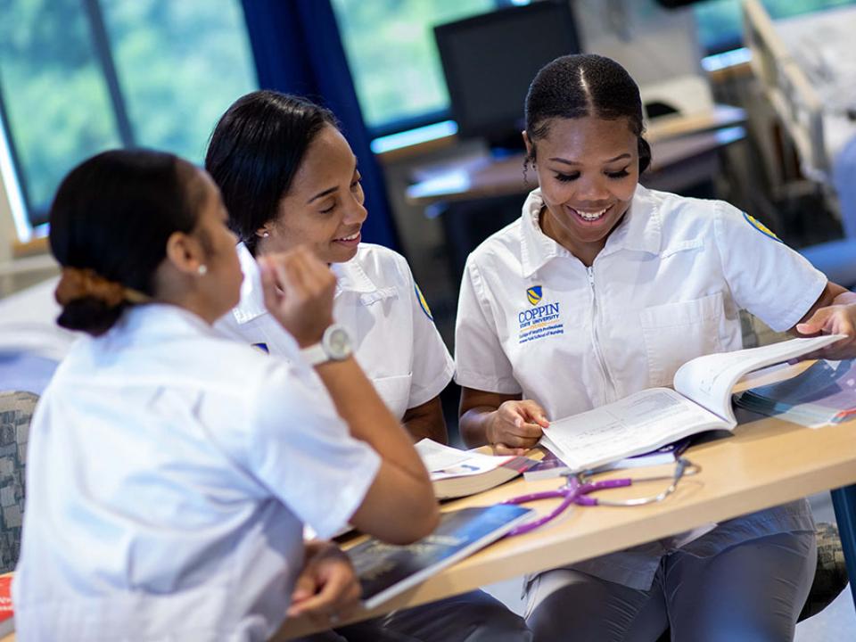 Three Coppin nursing students studying together