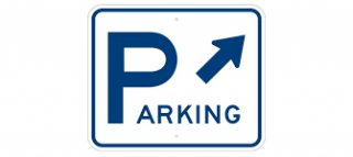 Traffic sign with the word parking and an arrow pointing to the top right of the sign