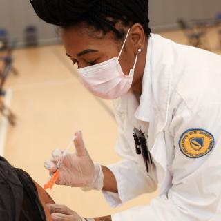 A Coppin State University Nursing Student gives a Vaccination