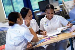 Three Coppin nursing students studying together