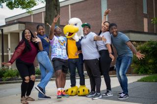 Students cheer with the Coppin State University Eagle