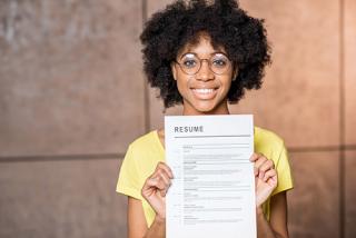 A Student holding their resume