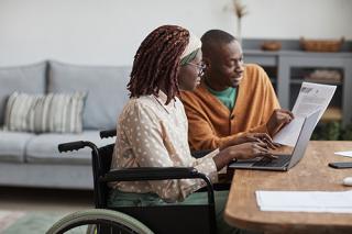 A rehabilitation services professional works with a client