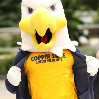 The eagle mascot wearing a yellow Coppin State Eagles shirt