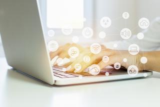 Woman typing on laptop