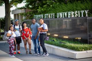 A group of students outdoors on campus