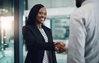 young businesswoman shaking hands