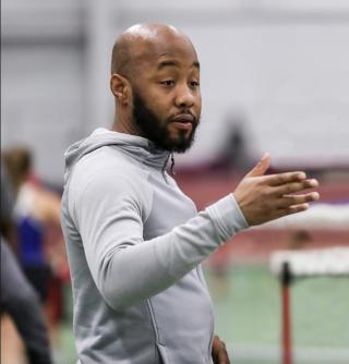 Greg breaking down a play for a student athlete 