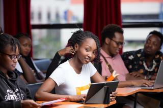 Student is smiling inviting the person looking at the major to learn more