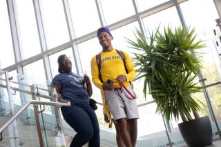 A male and female student walking to class