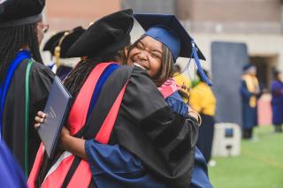 Graduate getting a hug.