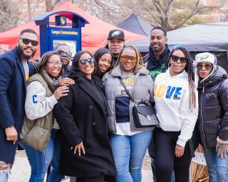 A group of Coppin alumni posing together.