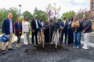 Faculty, staff, and student at tree planting ceremony for Earth Day. 