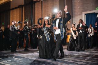 Miss and Mister Coppin walking into Coppin's Ball for 2026