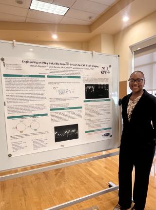 Oyelade with her presentation during UMSOM’s annual Student Research Forum