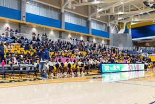 Coppin State University students, cheerleaders, and supporters gather in the Physical Education Complex for Eagle Madness 2026, filling the blue and gold bleachers with Eagle pride and school spirit.